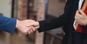 two people shaking hands